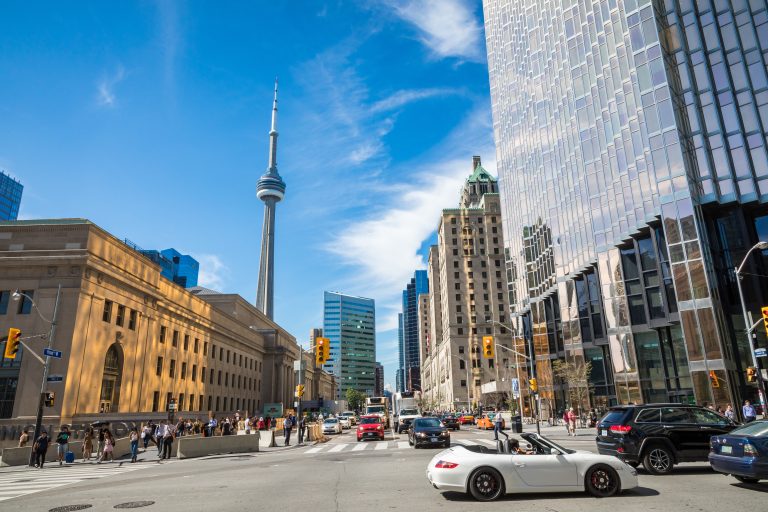 Rush hour atToronto's busiest intersections. Financial district at the background.